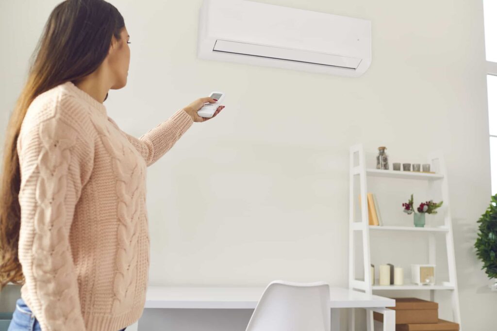 Women turn on the ac